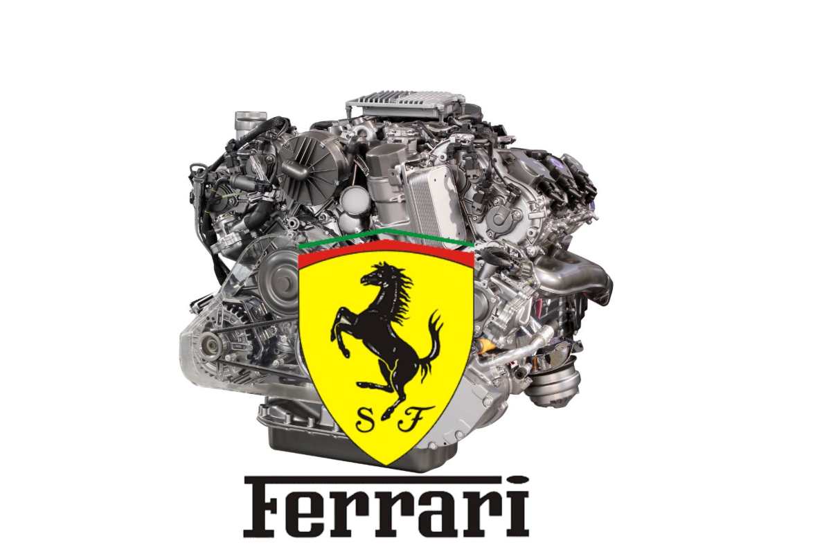 Un motore e il logo della Ferrari con la scritta