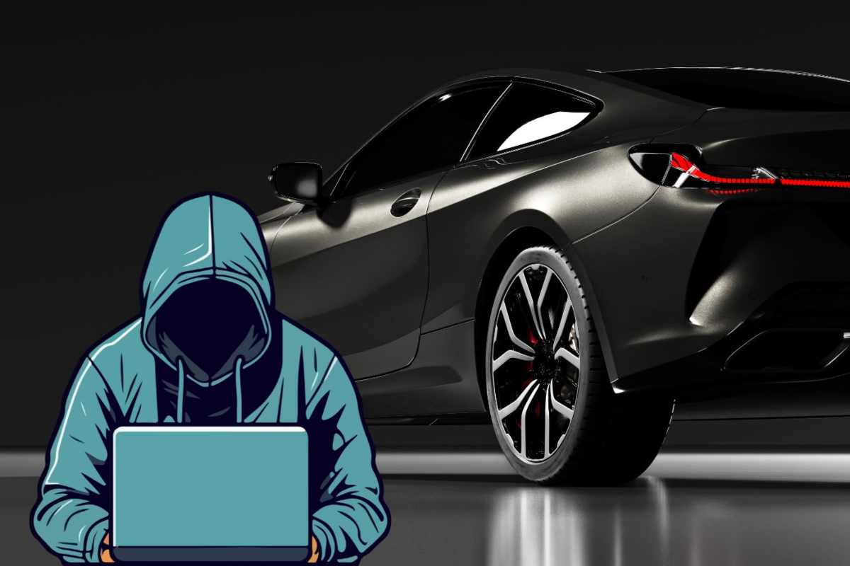 Un'auto nera e un hacker al pc