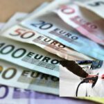 Euro e auto elettrica in ricarica